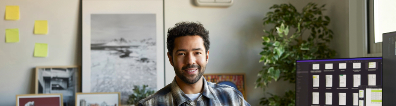 man in office smiling at Camera