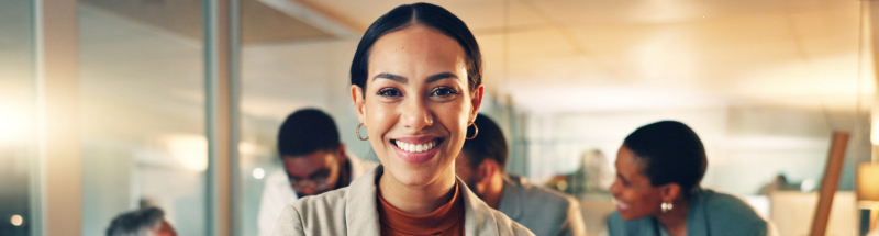 Confident woman smiling to the camera