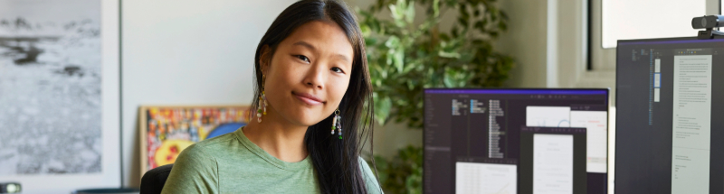 women in office smiling at camera